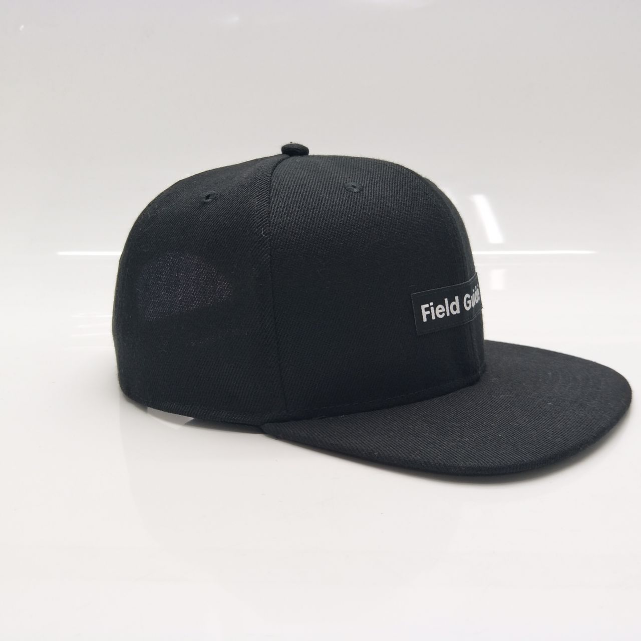 Black Field Guide Snap Back Patch Hat
